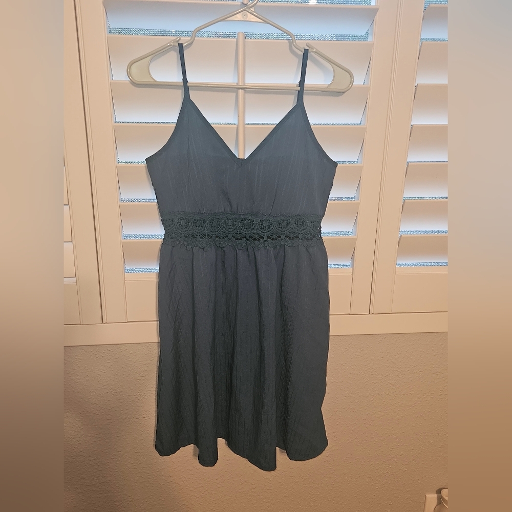 Small spaghetti strap teal dress with crochet detail around the waist from SHEIN